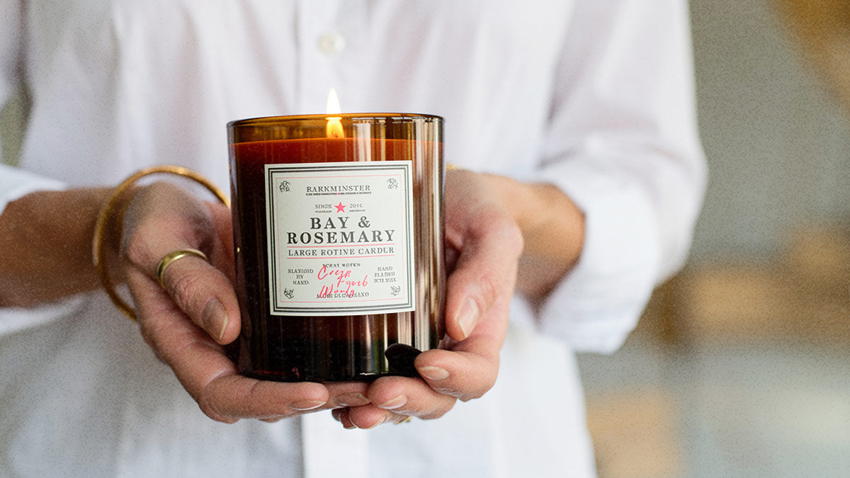 Person holding a Parkminster natural soy wax candle, showcasing a sustainable, botanical fragrance and clean non-toxic burning candle