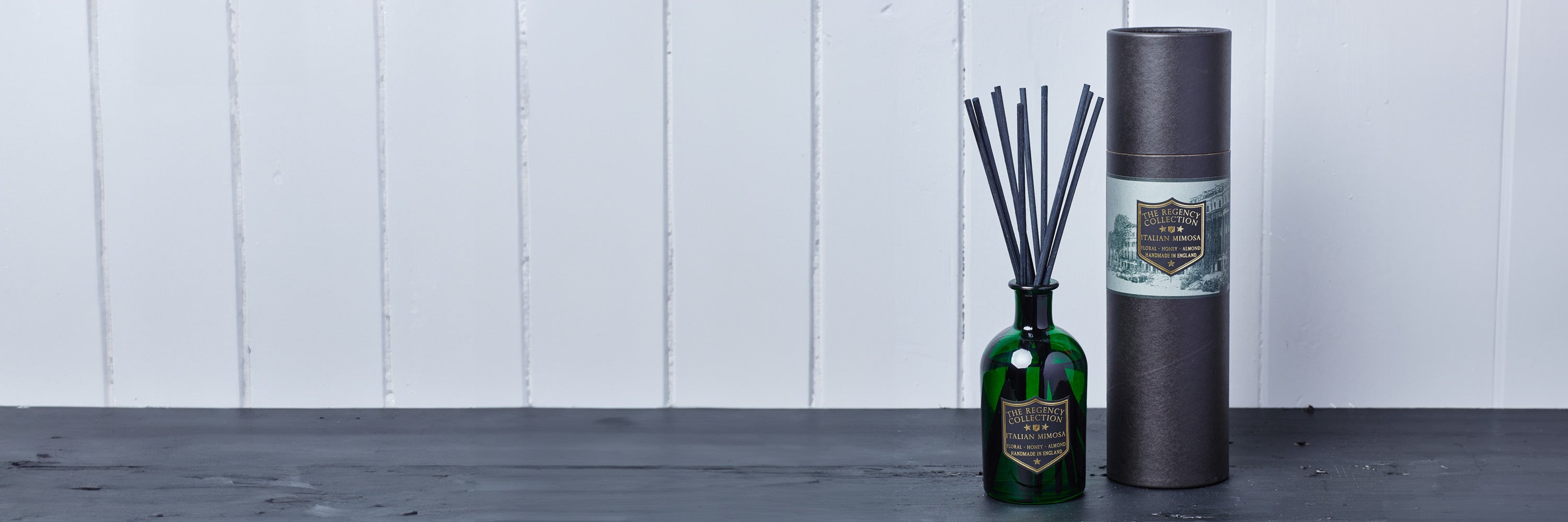 Regency Collection Reed Diffusers in bottle green glass with black and gold shield labels, inspired by the Victorian Grand Tour