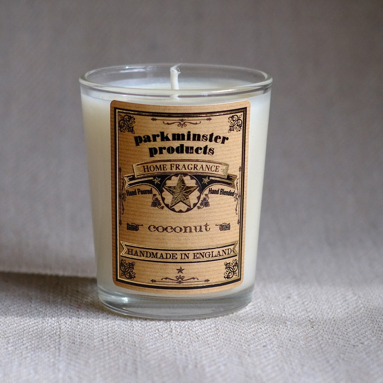 Coconut scented soy wax candle with fruity, nutty sweetness and creamy coconut notes. Enjoy a tropical getaway at home with hints of orchid, vanilla, and rose - Parkminster Natural Candles - 75g