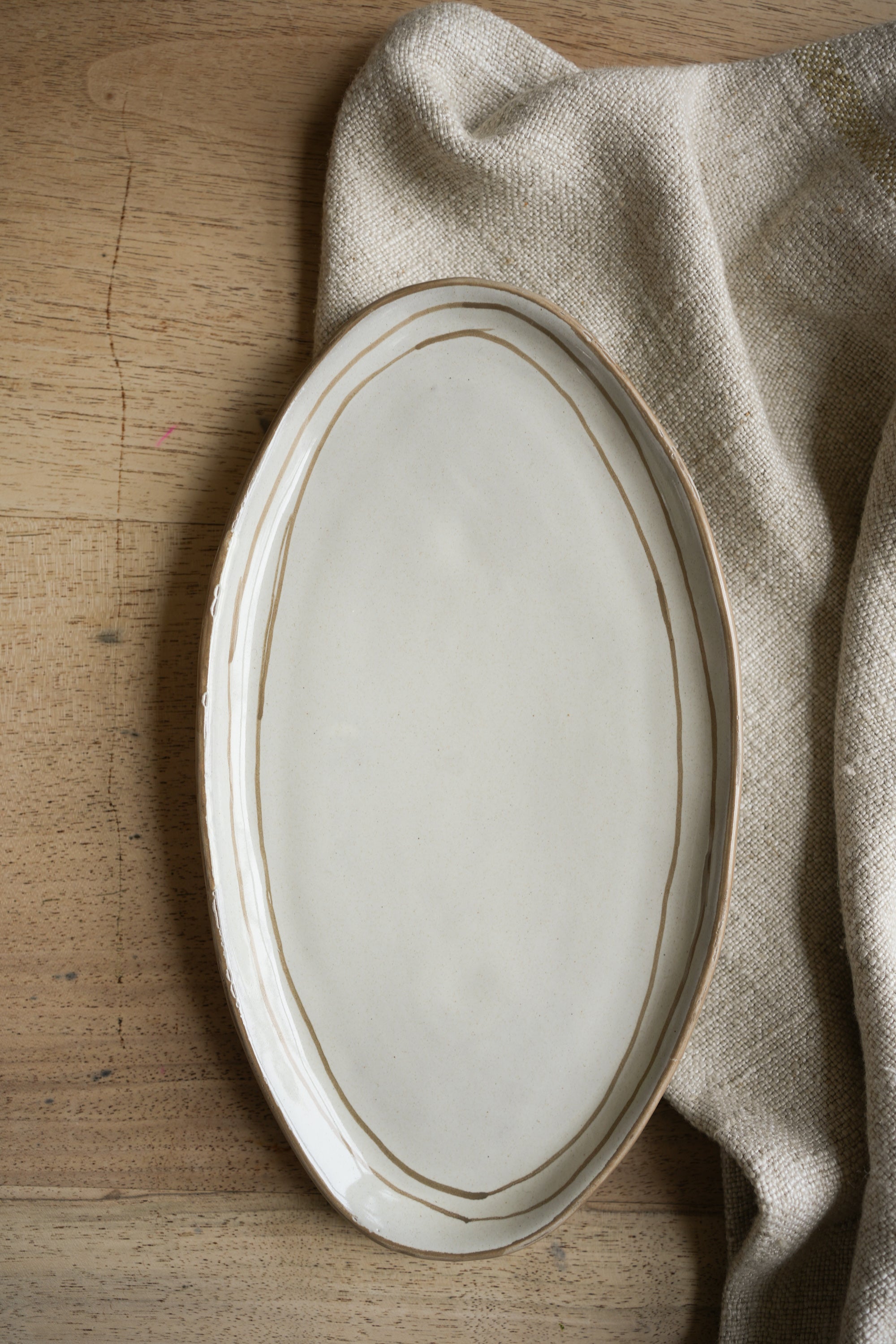 Hand Painted Breton Stripe Oval Plate - Taupe curated home decor piece by Parkminster Living