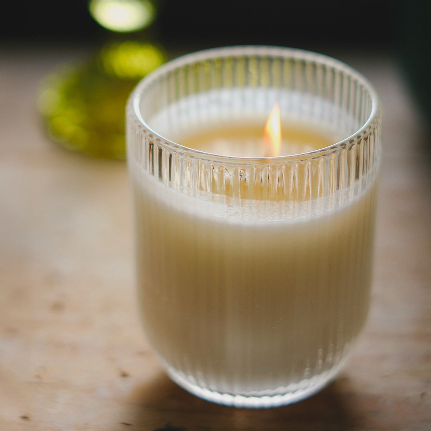 Parkminster Rosemary & Basil HÆFEN candle in ribbed glassware, with a refreshing blend of rosemary and basil to energise, promote focus, and create a revitalising atmosphere.