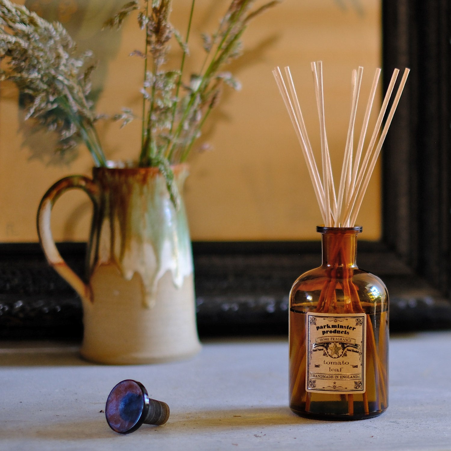 Enjoy the vibrant and fresh herbal aroma of Tomato Leaf with Parkminster's 200ml amber glass Apothecary Reed Diffuser. Crafted in our Cornish workshop using 100% plant-based ingredients, this diffuser provides a stylish and eco-friendly way to bring a green, natural scent to your home