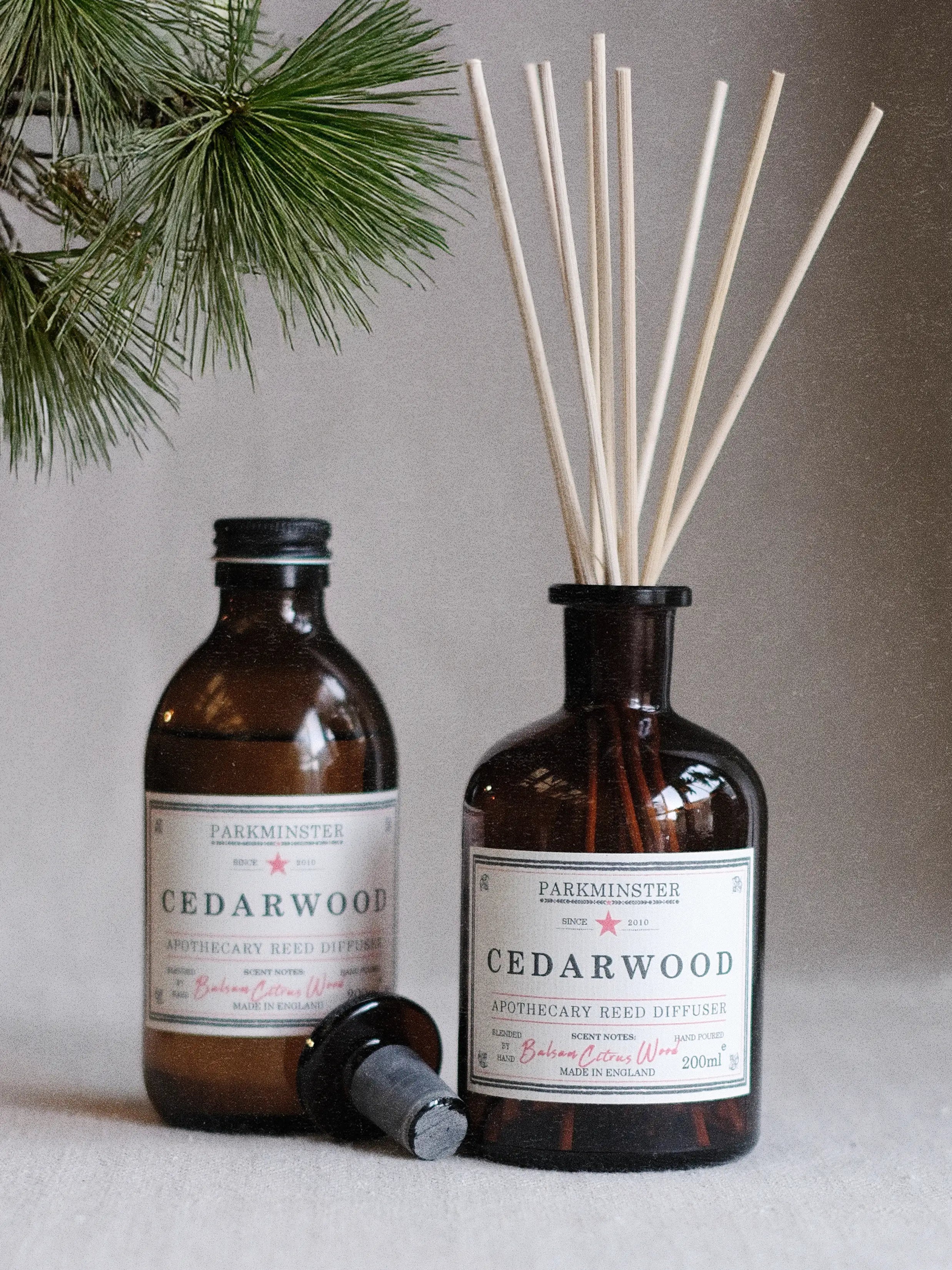 a Natural Cedarwood reed diffuser made with essential oils. A woody home fragrance in apothecary glass bottle, an ideal reed diffuser for him or for a calm home.