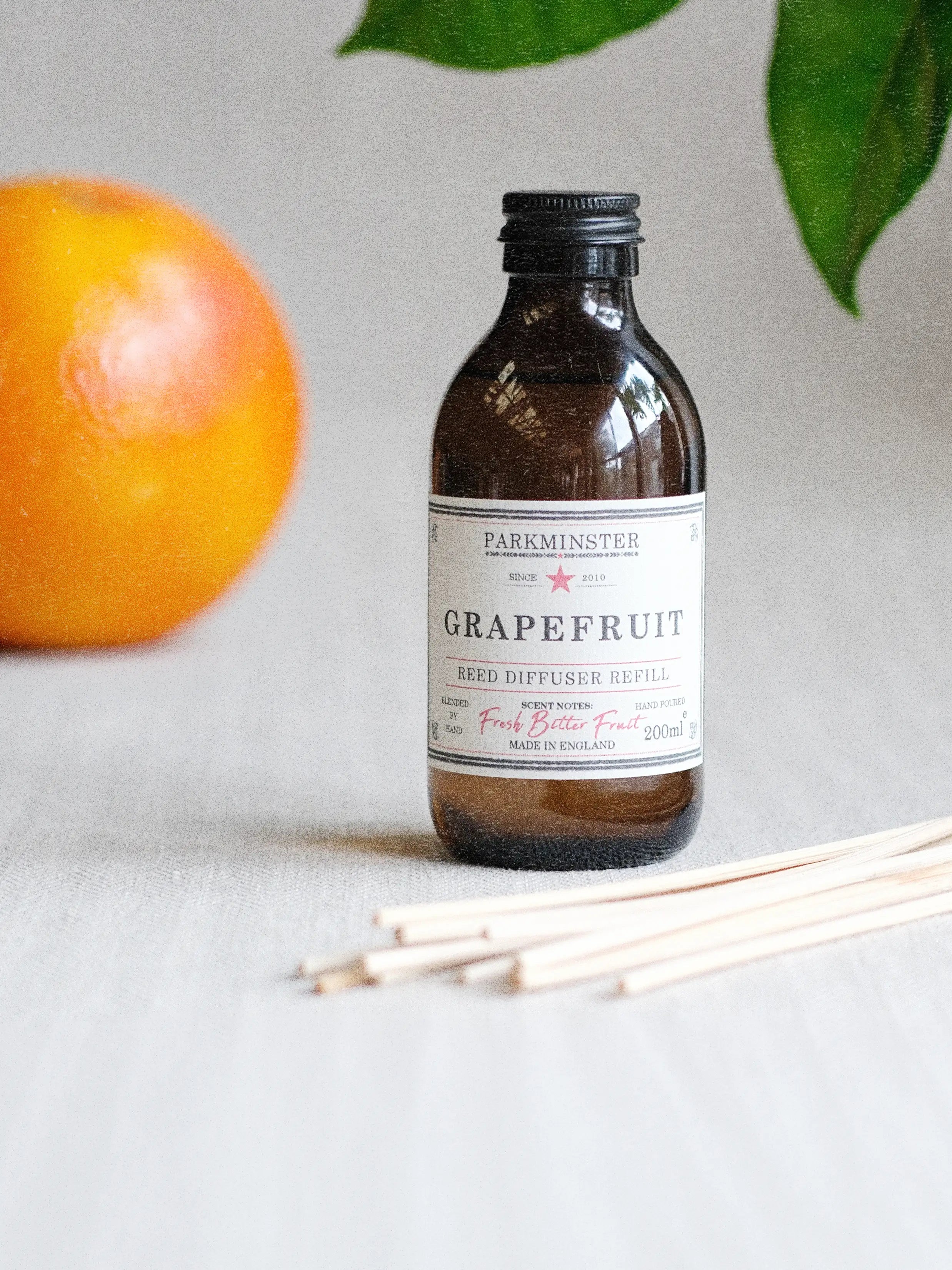 Parkminster Grapefruit Essential Oil Reed Diffuser Refill 200ml in amber glass with 100% essential oils and plant-based diffuser base