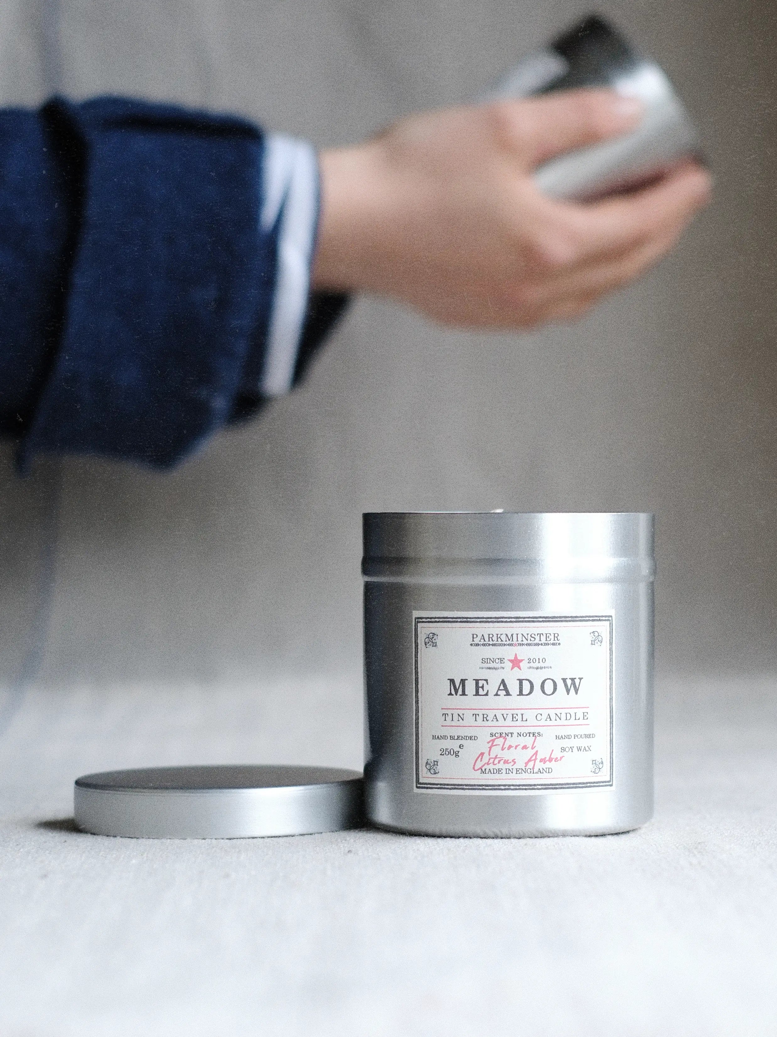 a Parkminster Meadow scented tin candle in aluminium tin with fresh floral fragrance, ideal for modern and rustic homes, kitchens, bathrooms and lounges