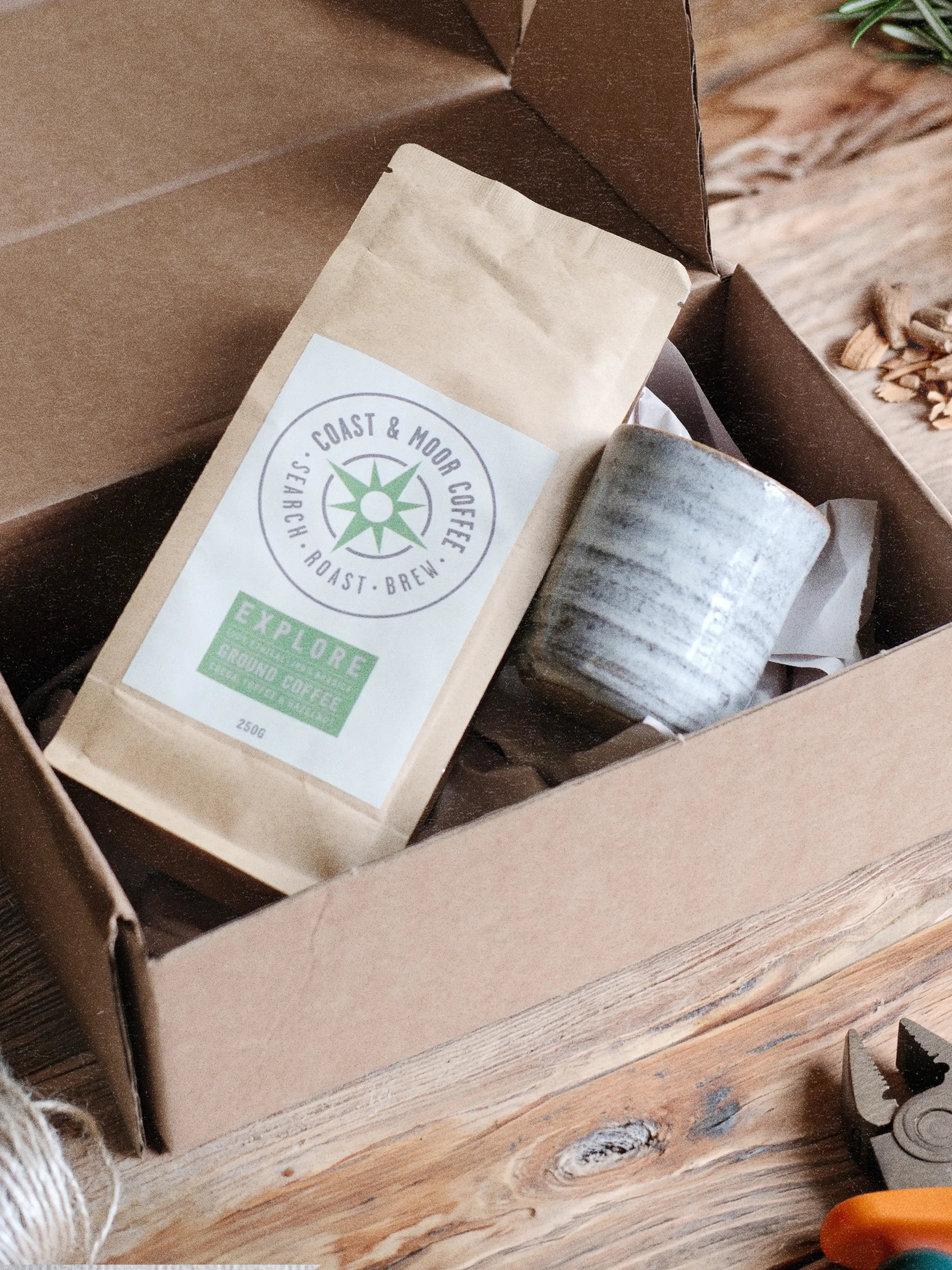 Parkminster's Gentleman’s Brew Box. A men’s candle and coffee gift box styled in a masculine garden shed setting, featuring a refillable ceramic candle pot and artisan coffee