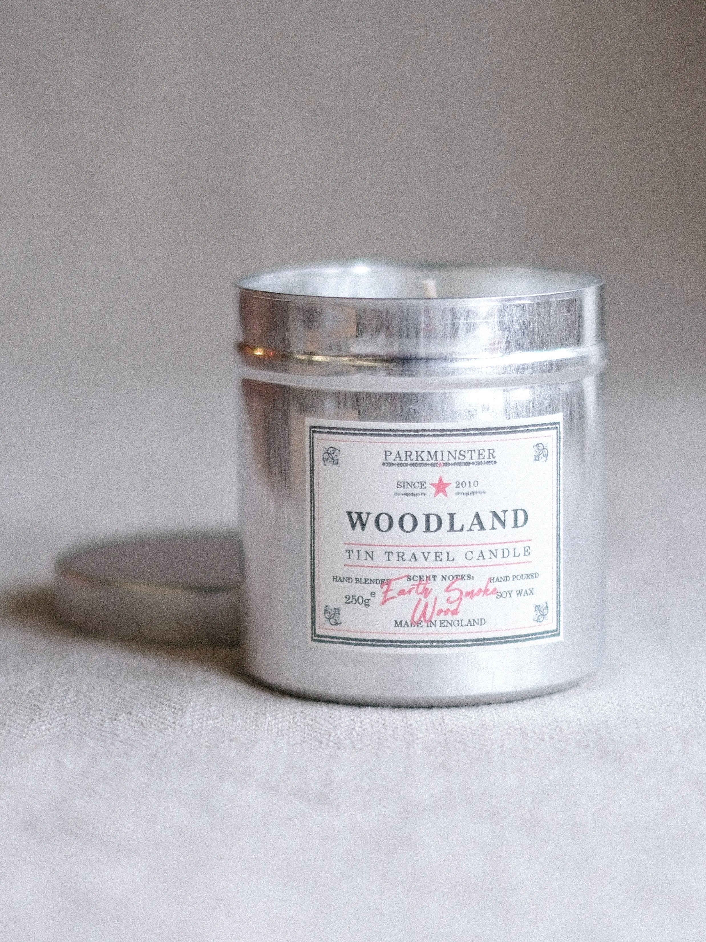 Parkminster woodland scented tin candle with rich oak, hickory and cedarwood fragrance in a reusable metal tin