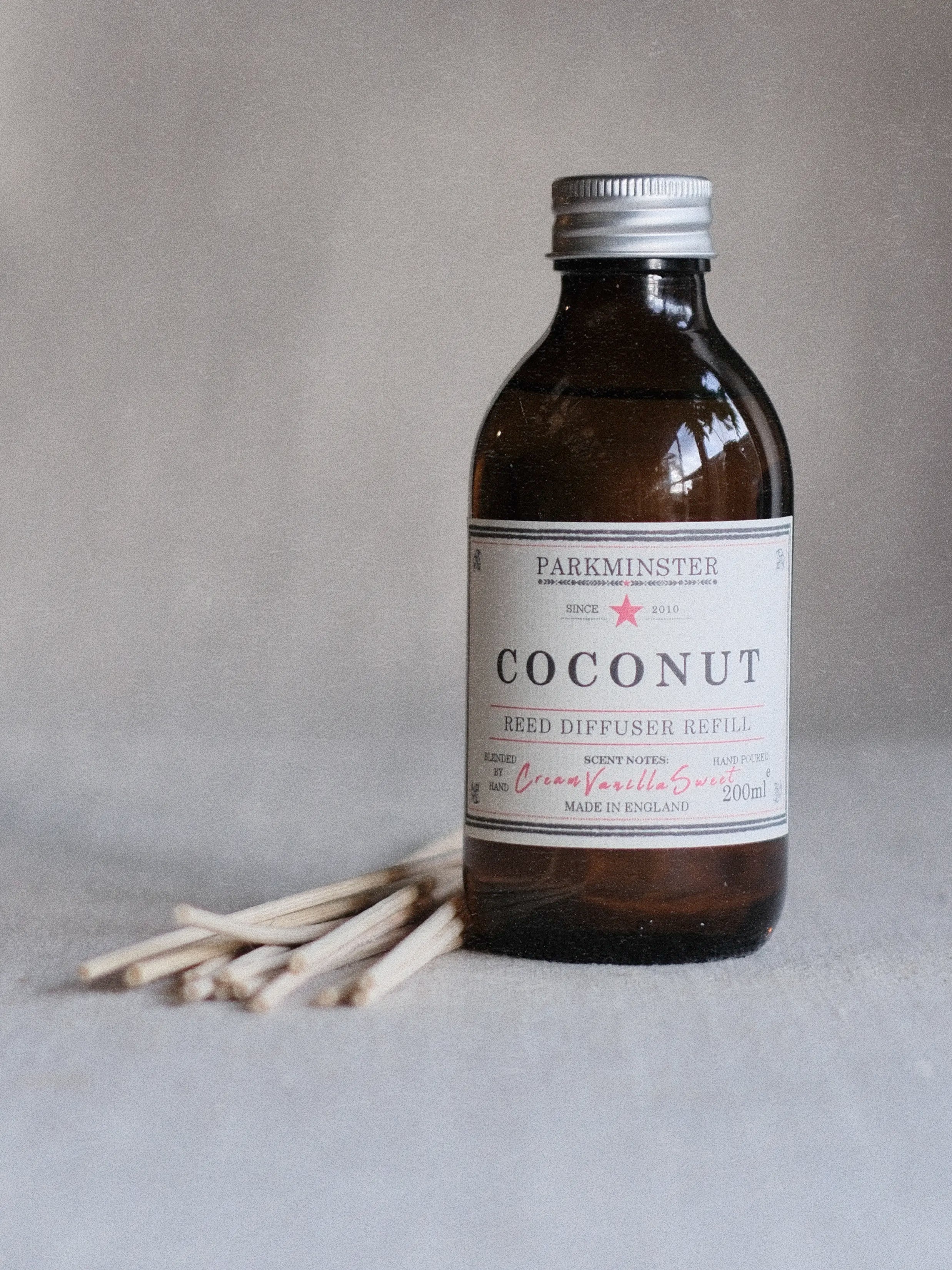 Parkminster Coconut & Vanilla natural diffuser refill bottle, celebrating its soft, comforting aroma.