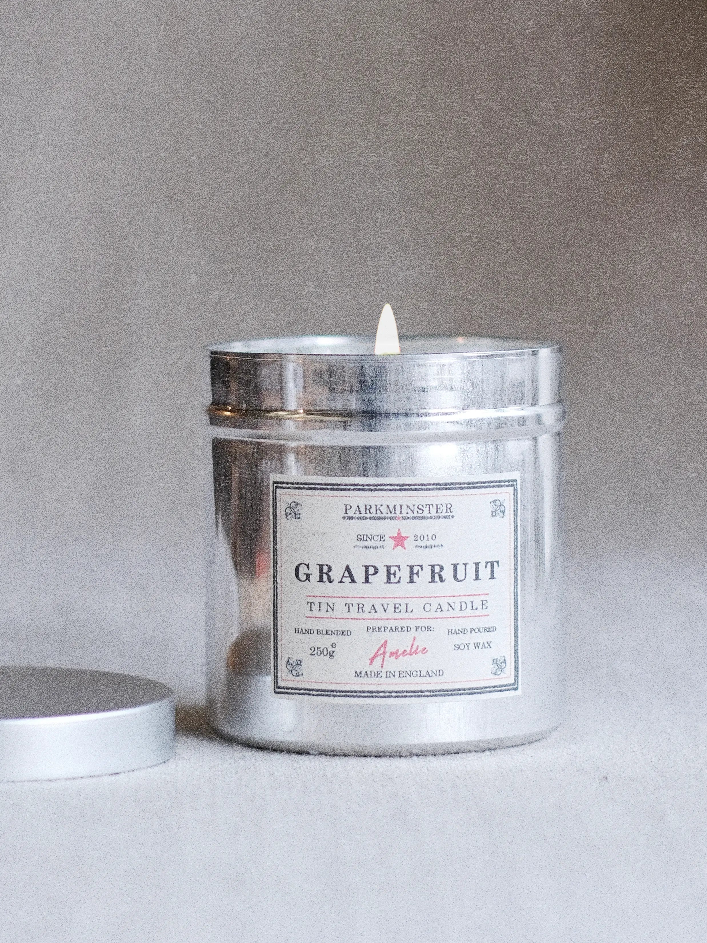 Grapefruit scented tin candle in reusable metal tin with natural soy wax