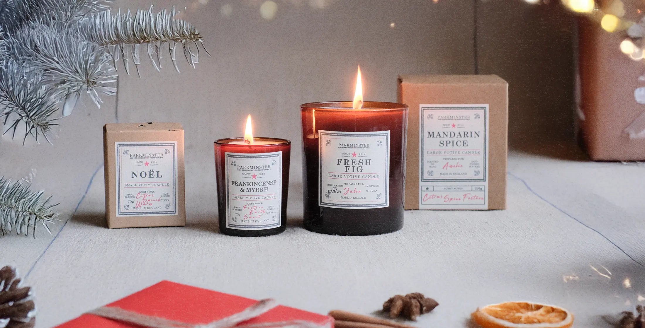 Handmade Parkminster Large and Small Votive candles glowing warmly at Christmas – natural soy wax and essential oil candles, ideal festive gifts for family and friends.