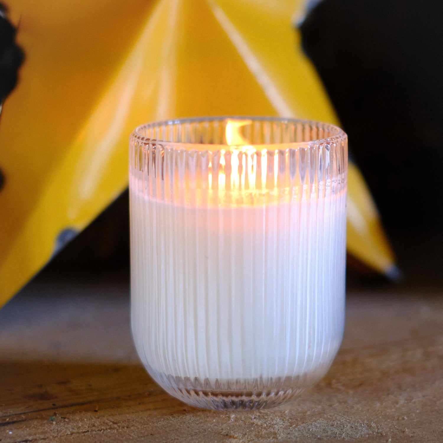 Parkminster Grapefruit HAVEN Candle in ribbed glassware, offering a refreshing citrus fragrance and a soothing glow to revitalise any space.