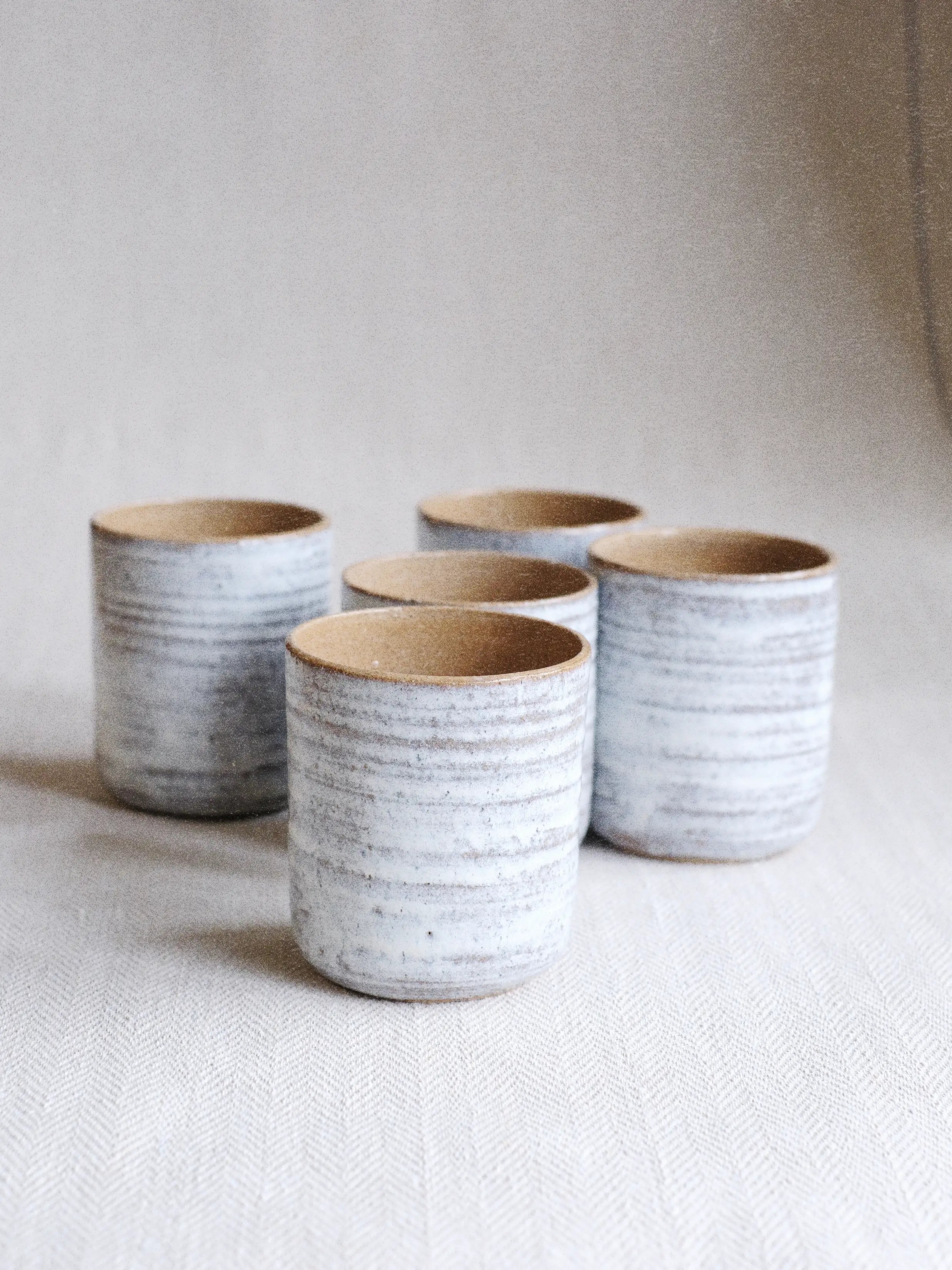 a Refillable ceramic candle pot by Parkminster and Jenna Bray Ceramics. handmade in the UK designed for endless refills and sustainable natural wax candles