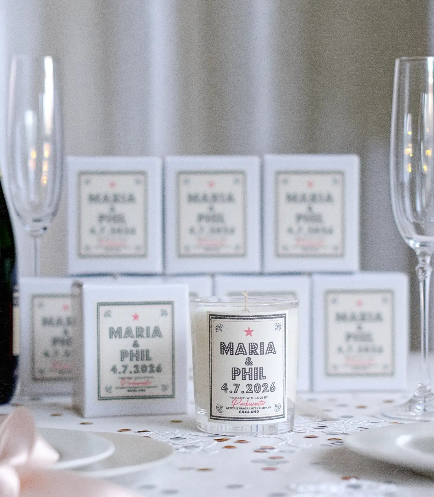 Parkminster wedding favour candles on a styled wedding reception table with lace, champagne and ribbons, suitable as bridesmaids gifts and wedding table gifts for UK weddings