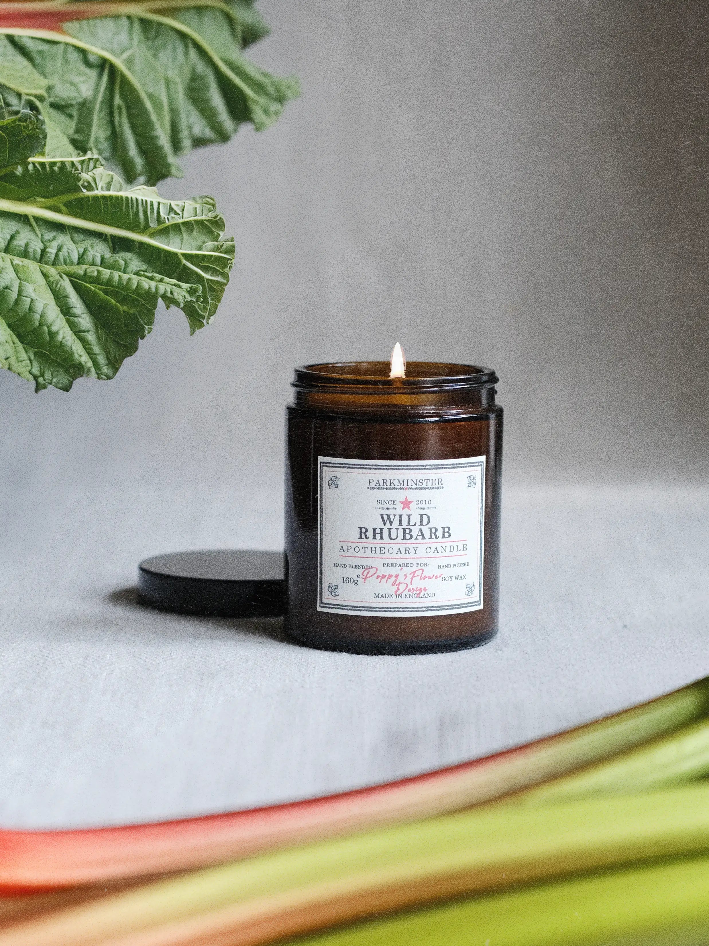 Parkminster Wild Rhubarb Apothecary Candle in vintage amber glass jar with natural soy wax and fresh fruity fragrance for modern interiors