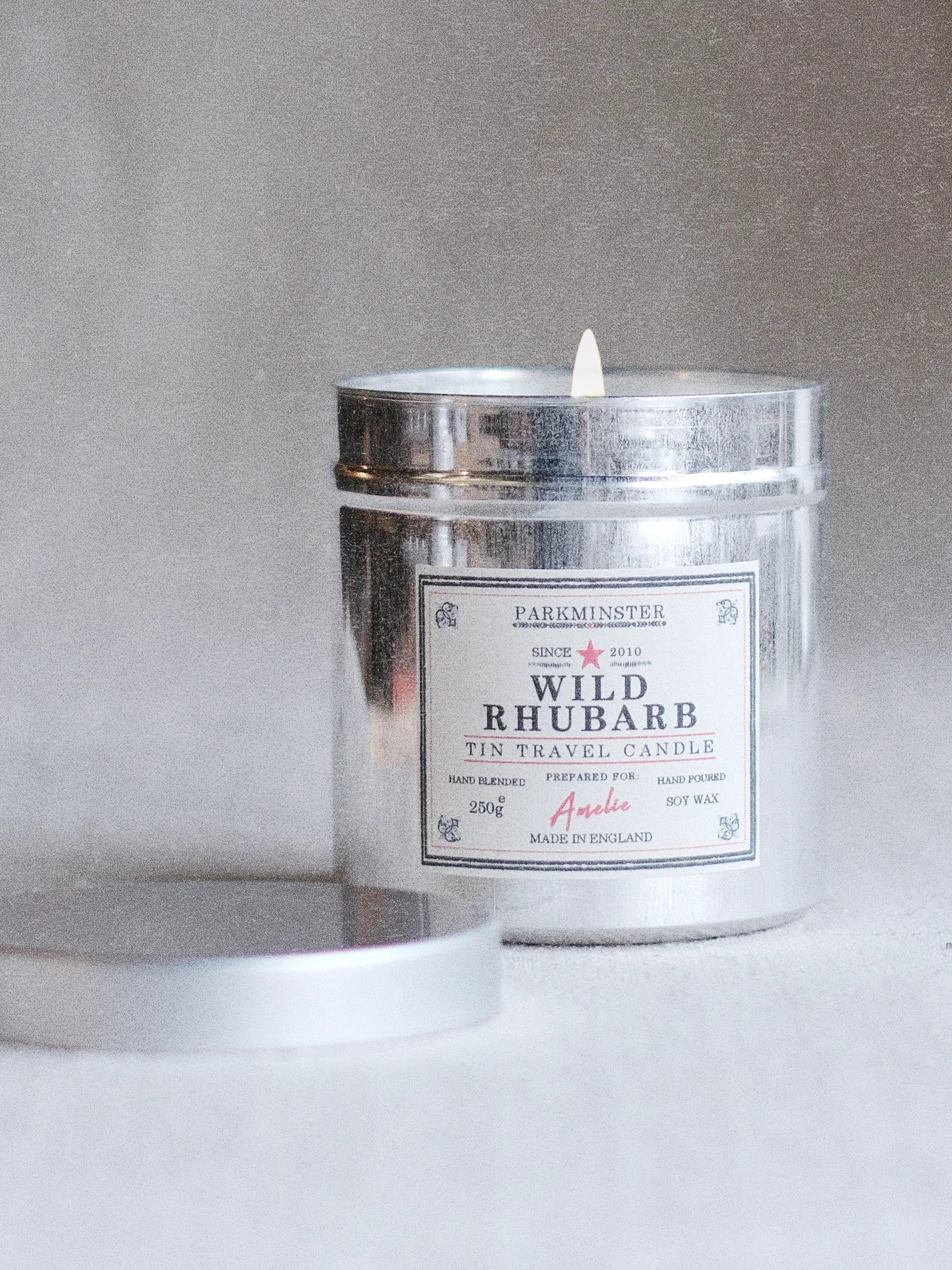 a Wild Rhubarb scented tin candle with fresh, fruity rhubarb aroma in stylish aluminium reusable tin