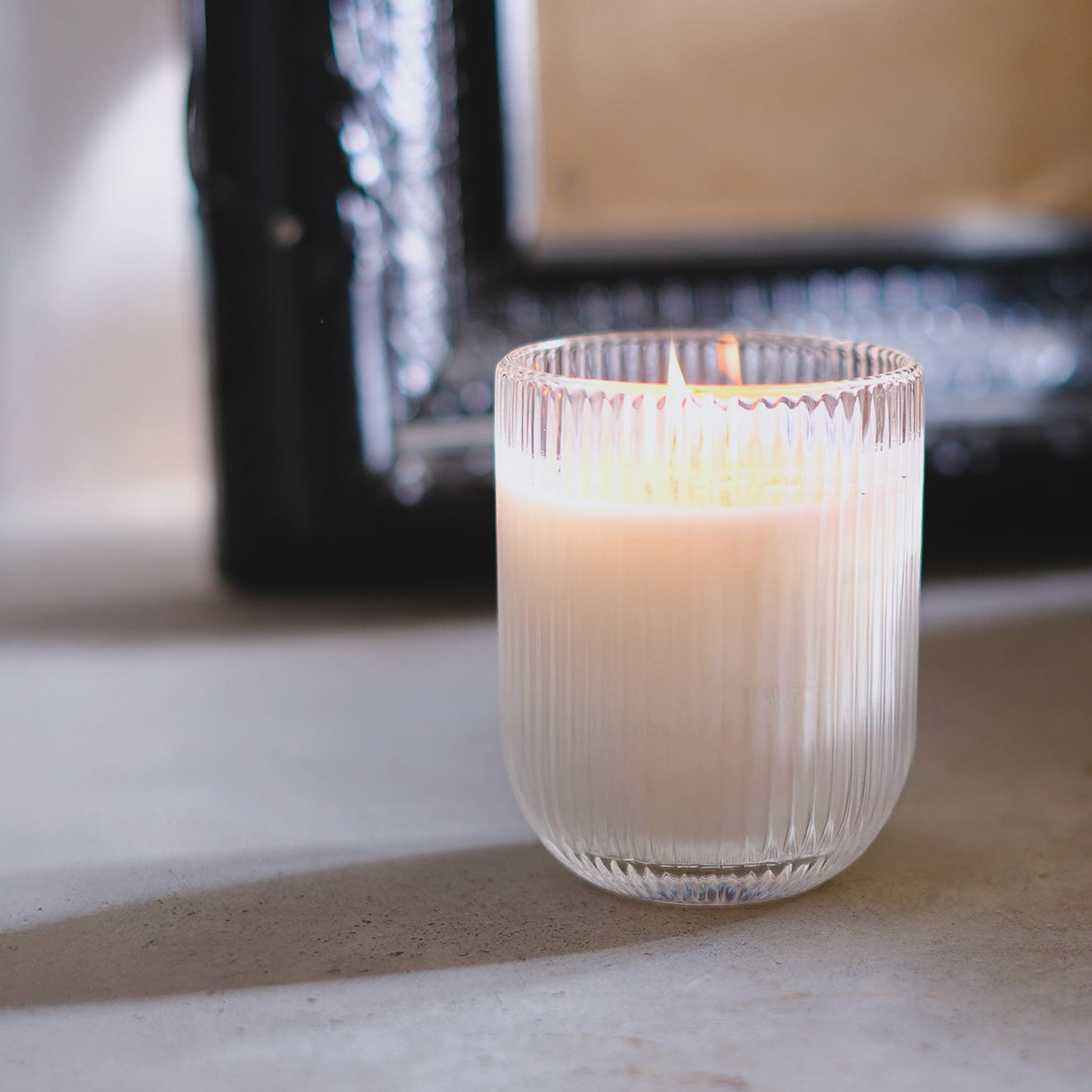 Patchouli hæfen soy wax scented candle by Parkminster Home Fragrance Co. Spice, sweet, and earthy notes in ribbed glassware for a calming glow. HAVEN-inspired.