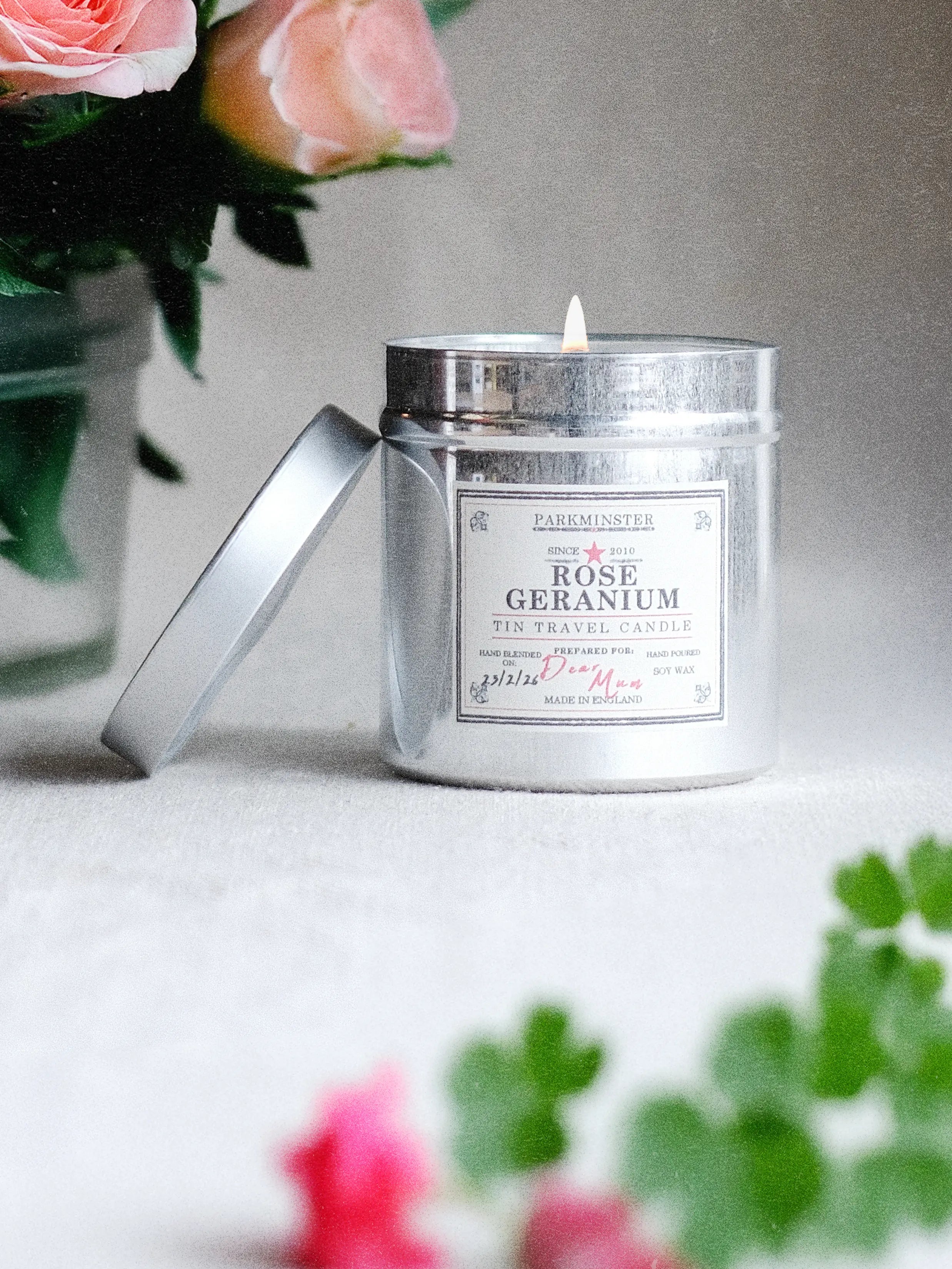a Parkminster Rose Geranium Scented Tin Candle made with natural soy wax and pure essential oils, combining floral rose and crisp geranium leaf for a fresh, natural fragrance, perfect as a candle gift or Mother’s Day treat.