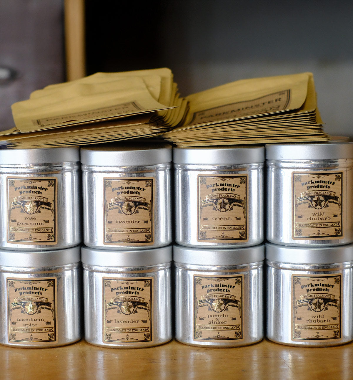 Handcrafted scented candles being carefully packed for independent stockists across the UK, supporting small businesses and thriving high streets.