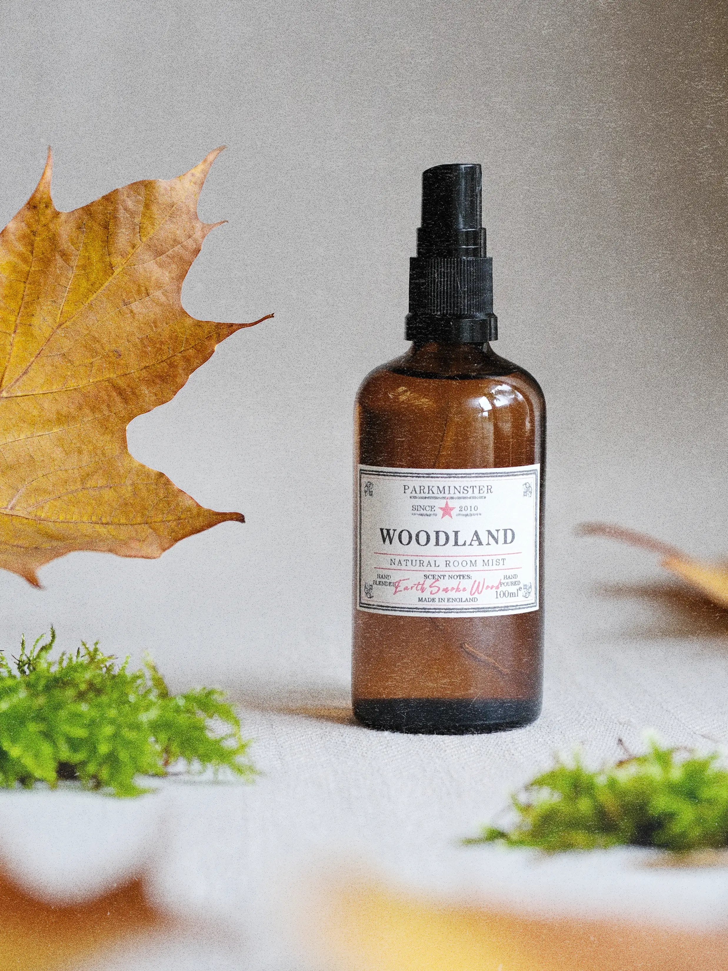 a Amber Glass Bottle Woodland Room Spray 100ml with a natural woody fragrance mist, by Parkminster