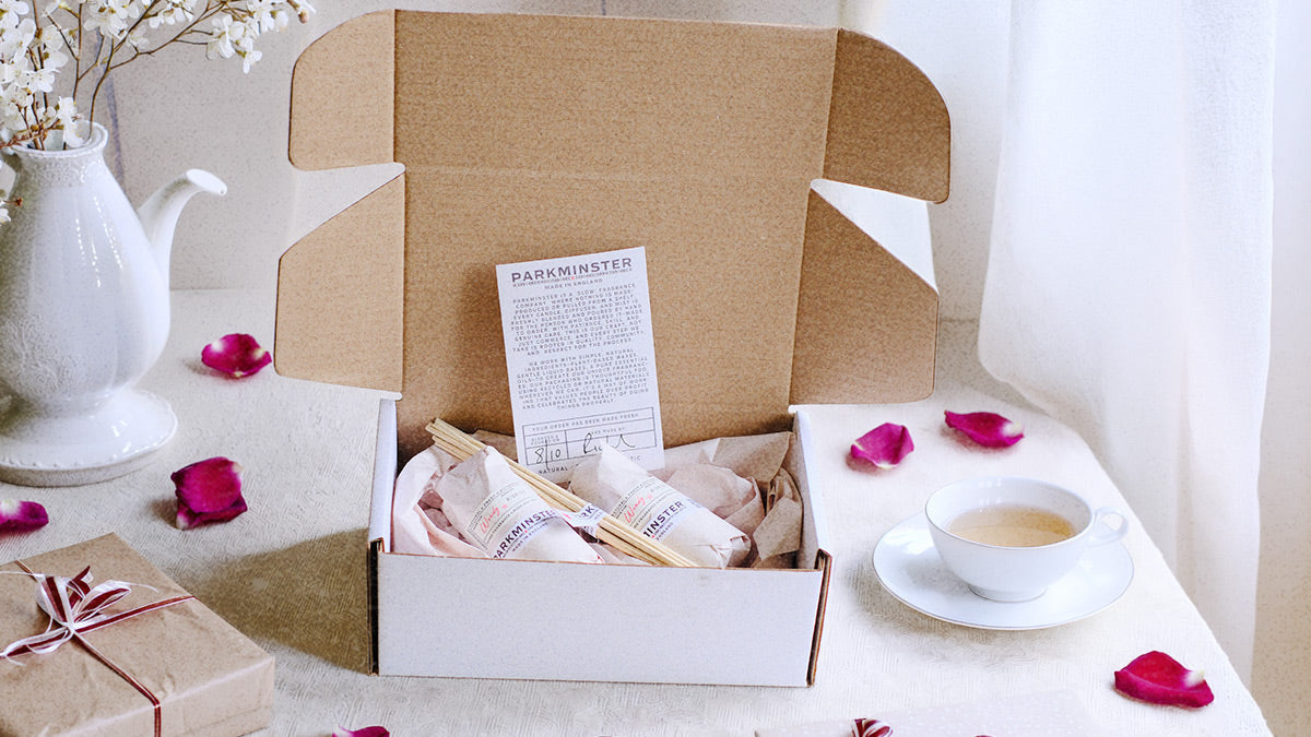 Parkminster Home Fragrance Co candle gift set displayed on a classic white table in a bright, elegant setting, styled for a refined lifestyle and home fragrance blog feature.