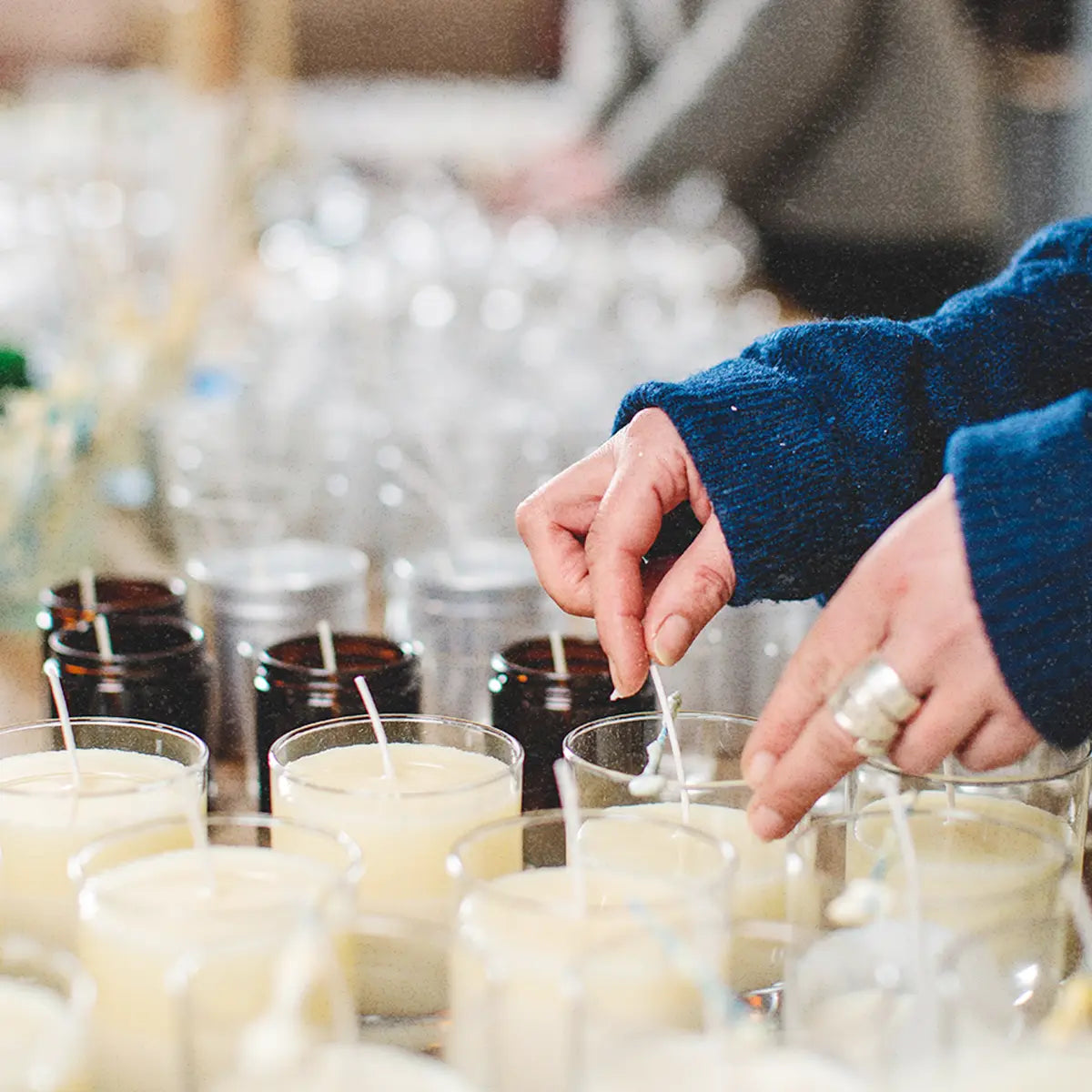 a person pouring soy wax scented candles at Parkminster Home Fragrance Company