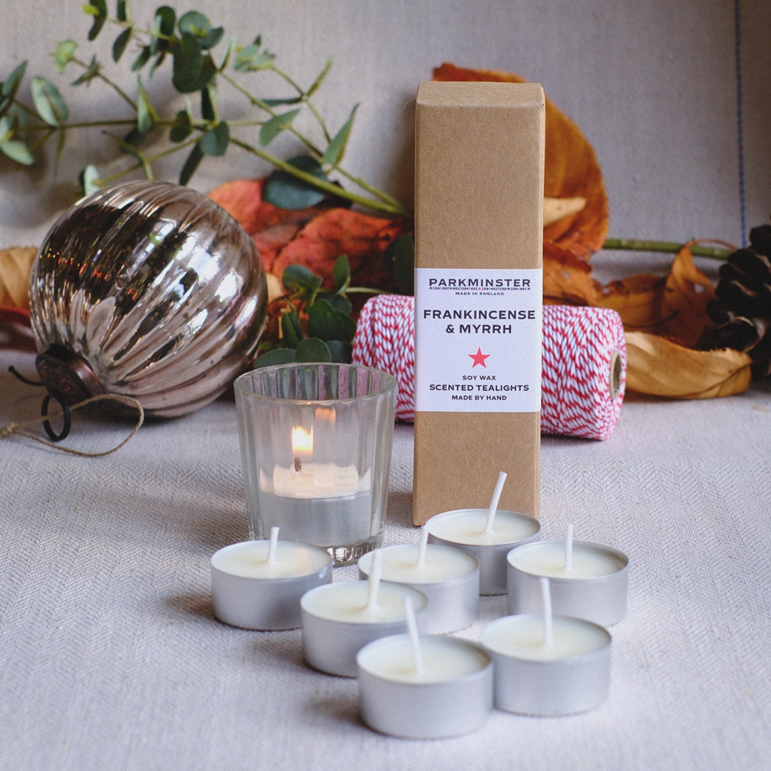 Frankincense & Myrrh scented tealight candles by Parkminster, hand-poured in the UK with woody, earthy notes and a hint of liquorice; pack of 8.