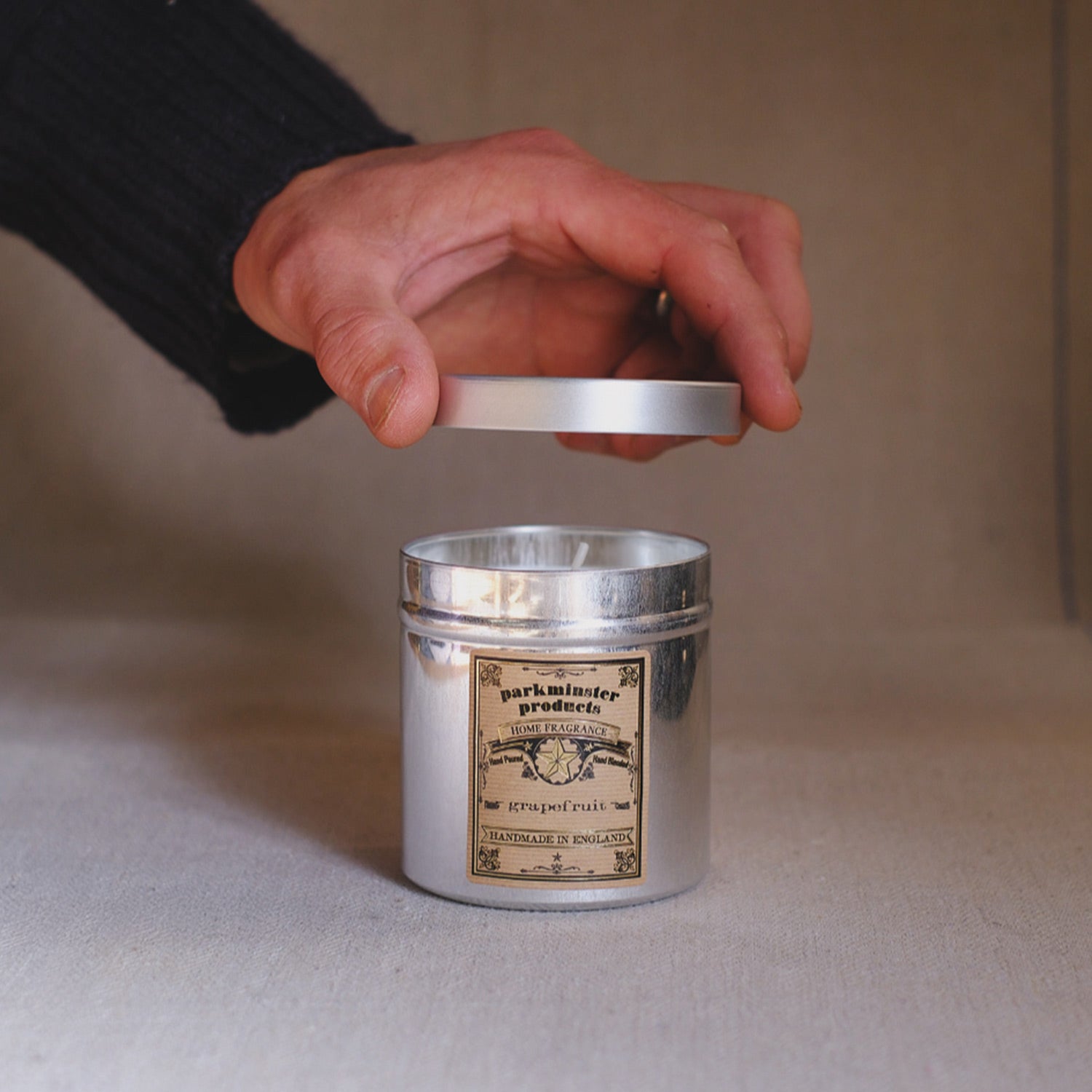 Parkminster Grapefruit Scented Tin Candle with natural soy wax, capturing the fresh, zesty scent of citrus in a stylish aluminium tin, perfect for refreshing any space.