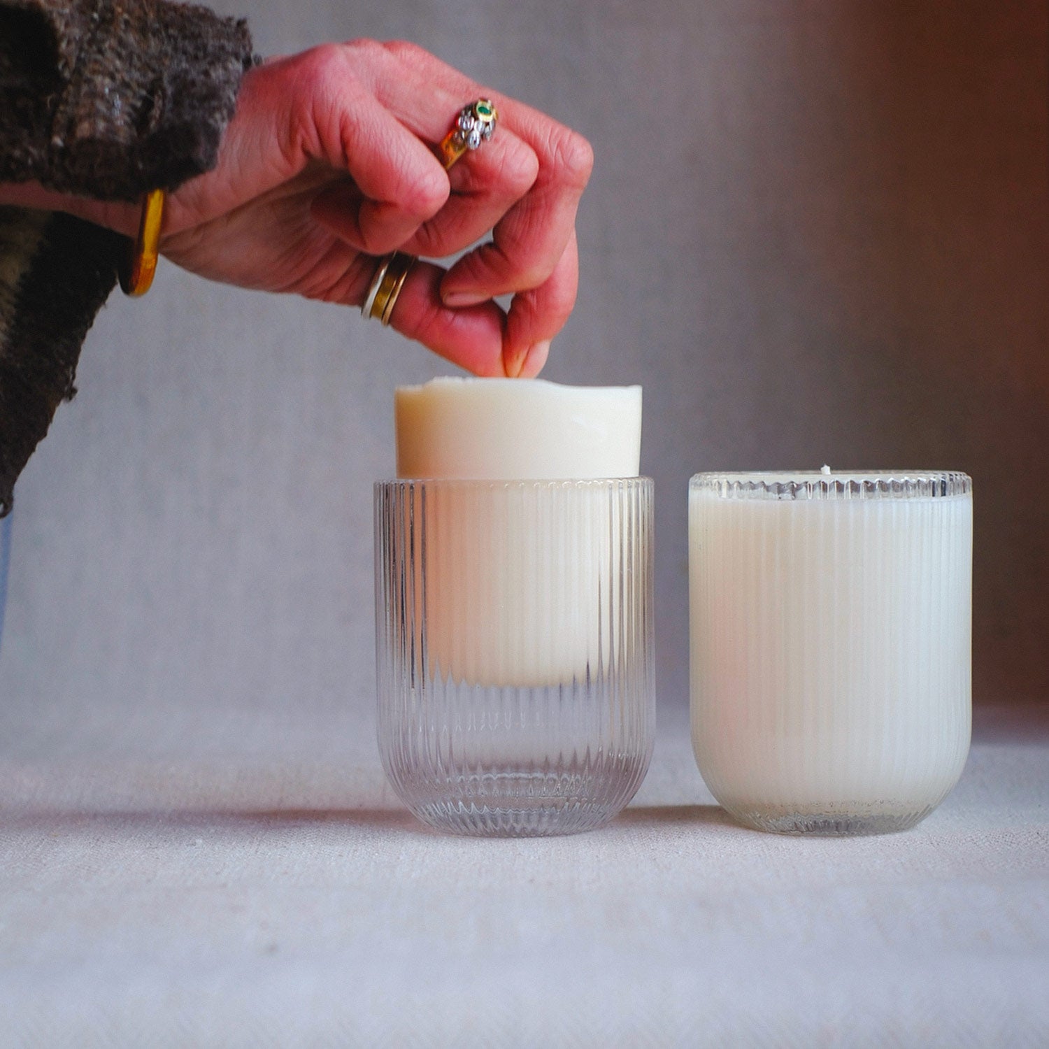 Parkminster Home Fragrance Co's 200g soy wax candle refill being placed into a HÆFEN Candle jar. Available in 28 natural fragrances.