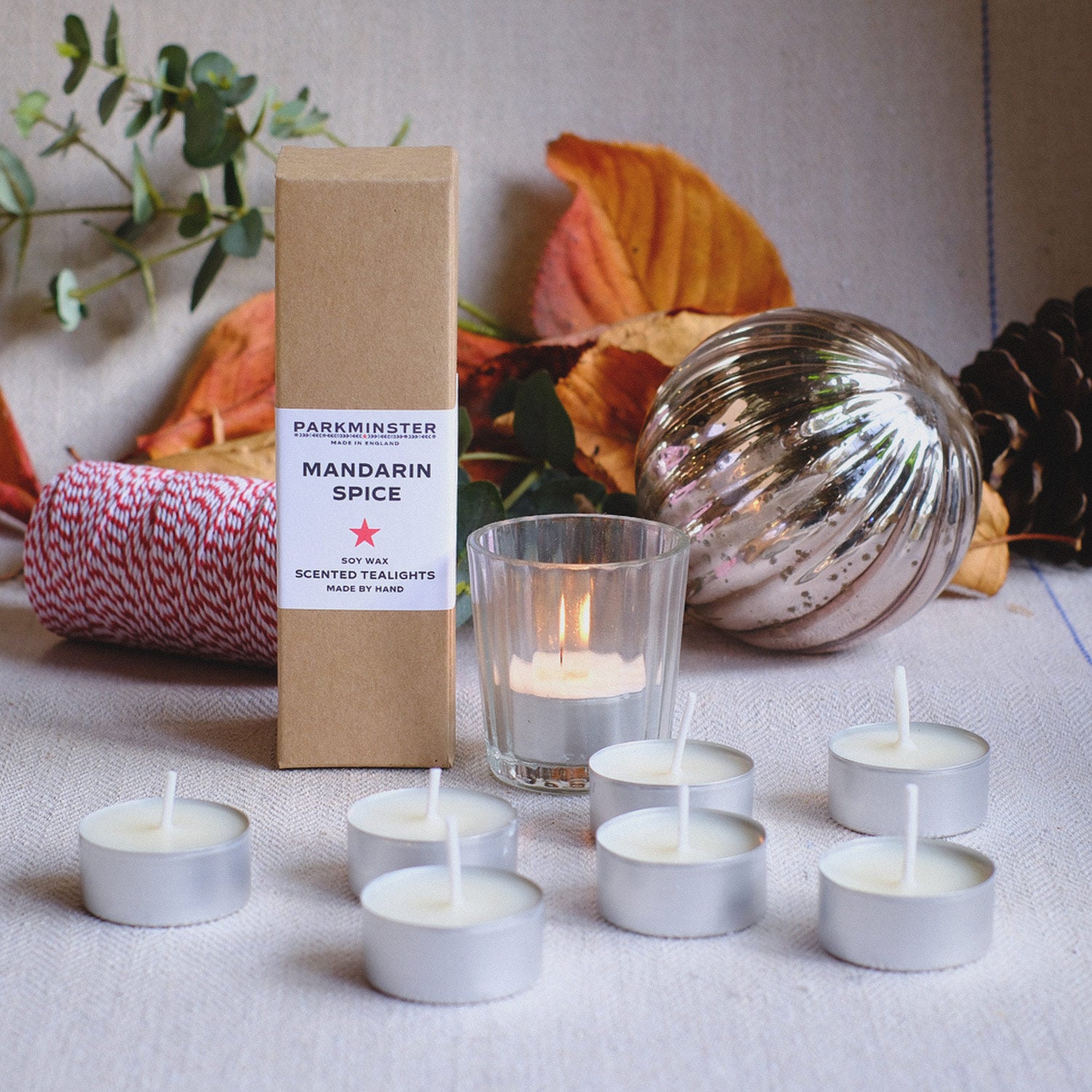 Mandarin Spice scented tealight candles by Parkminster, hand-poured in the UK with essential oils of Cinnamon, Clove & Mandarin; pack of 8 for a festive home.