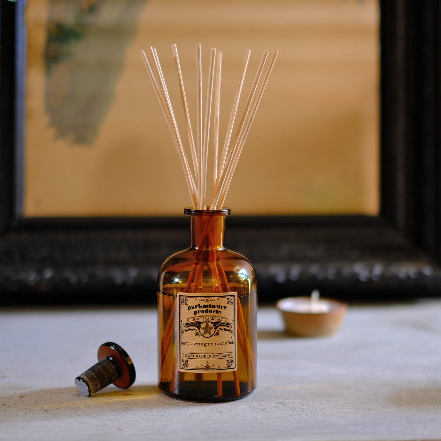 Bring the delightful scent of Pomegranate into your home with the Amber Glass Apothecary Collection 200ml Reed Diffusers by Parkminster Home Fragrance Co (Cornwall). These diffusers provide a fruity and invigorating aroma, perfect for creating a lively and welcoming atmosphere.