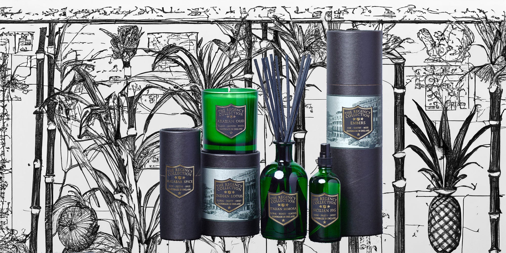 Parkminster Regency Collection scented candles, reed diffusers and room mists displayed over vintage Regency pineapple wallpaper and architectural house plans, showcasing luxury home fragrances in bottle green glass.