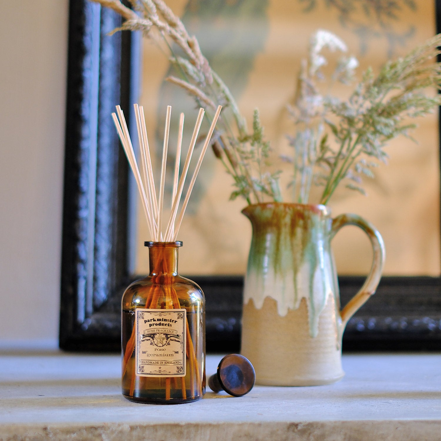 Indulge in the pure and natural scent of Rose Geranium with Parkminster's 200ml amber glass Apothecary Reed Diffuser. Created in our Cornish workshop using 100% plant-based ingredients, this diffuser provides a stylish and eco-friendly way to freshen your home without any chemical odours