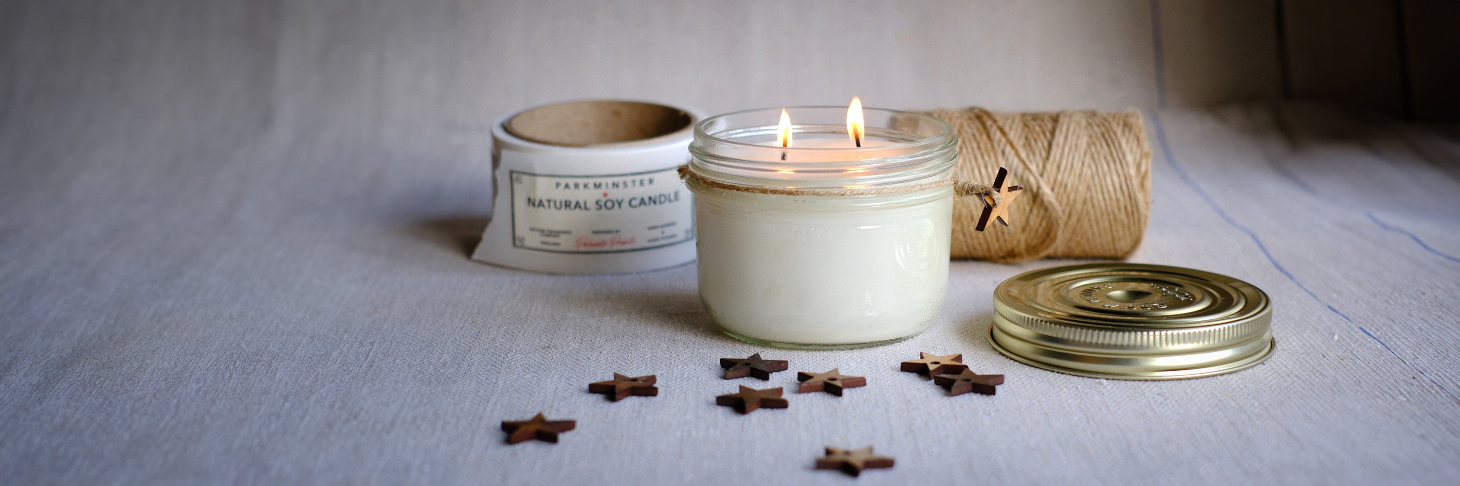 A beautifully crafted Parkminster Vintage Star Jar Candle, featuring two wicks and made from soy wax infused with hand-blended essential oils. Available in 26 fragrances, this candle is lovingly hand-poured in our small country workshop.