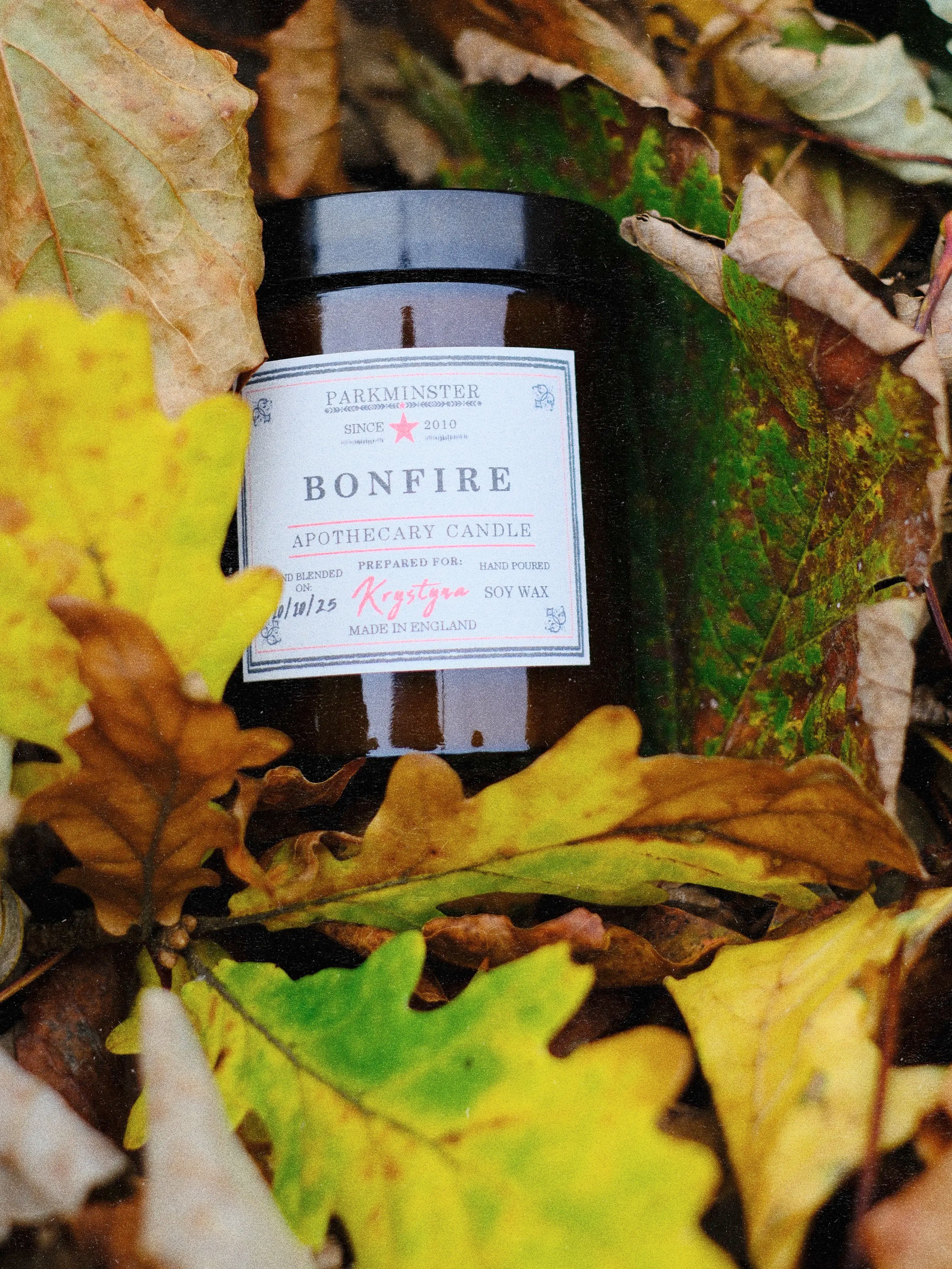 Parkminster Bonfire Apothecary Candle in amber glass, hand-poured in Cornwall with a warm smoky woody fragrance inspired by autumn bonfires and crackling fires.