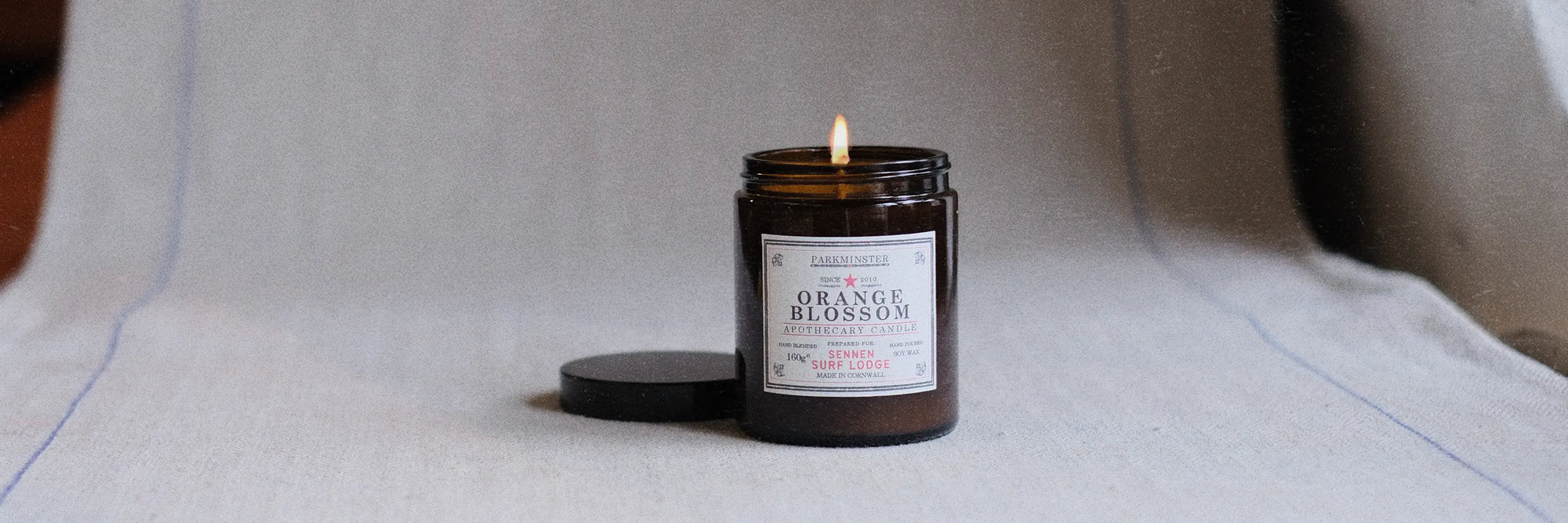 a Parkminster hand-poured natural soy candle in an amber apothecary jar, made to order with botanical fragrances for medium and larger rooms

