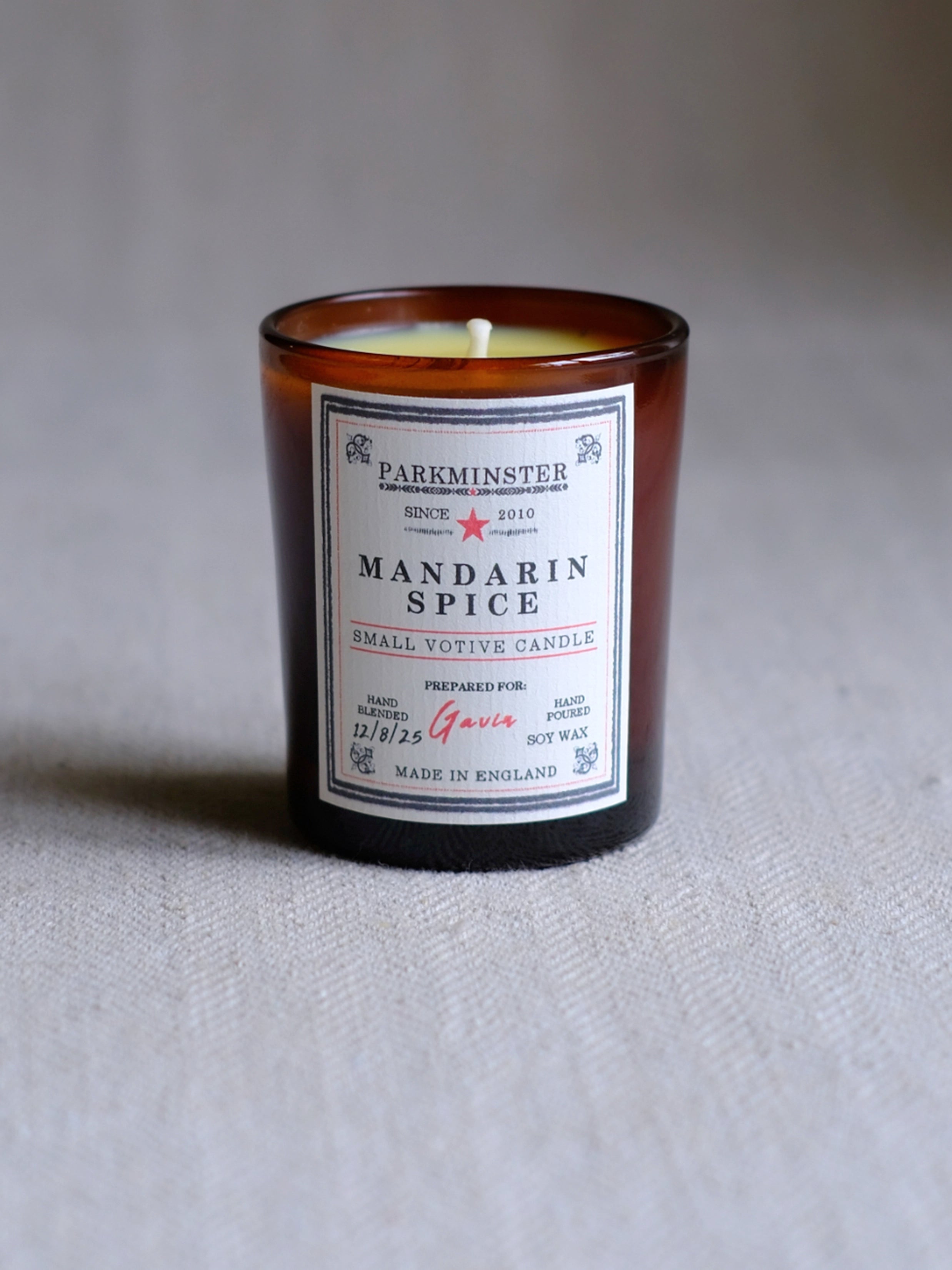 Parkminster’s Mandarin Spice Small Votive Candle in natural soy wax, available boxed for gifting or unboxed for everyday use, blending warm spices with zesty mandarin for a cosy, festive scent.