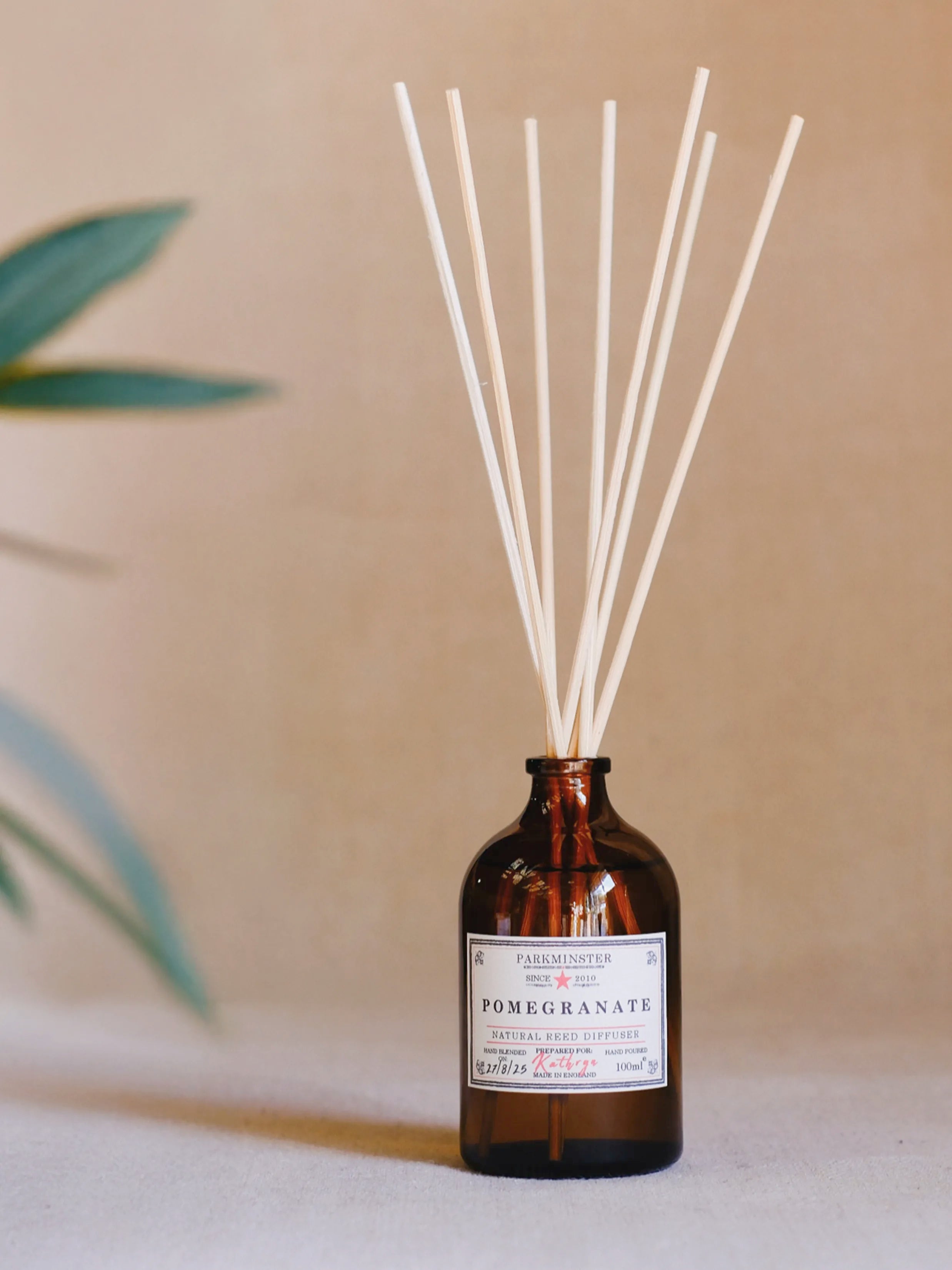 Parkminster Pomegranate reed diffuser – fruity and vibrant natural home fragrance, hand-blended and poured into amber glass for a stylish diffuser