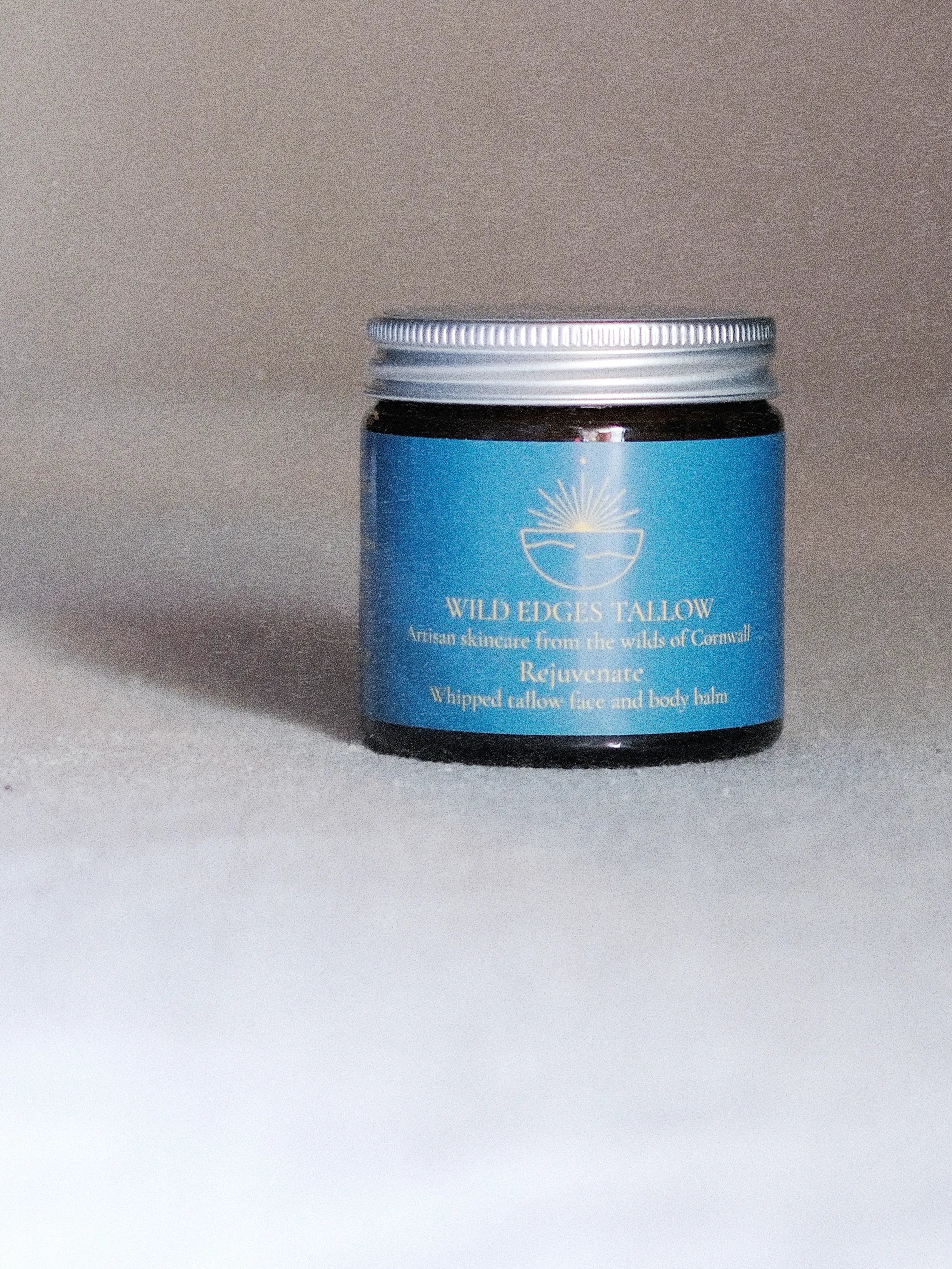 jar of Rejuvenate Face & Body Balm with organic oils and botanical ingredients, natural skincare focus