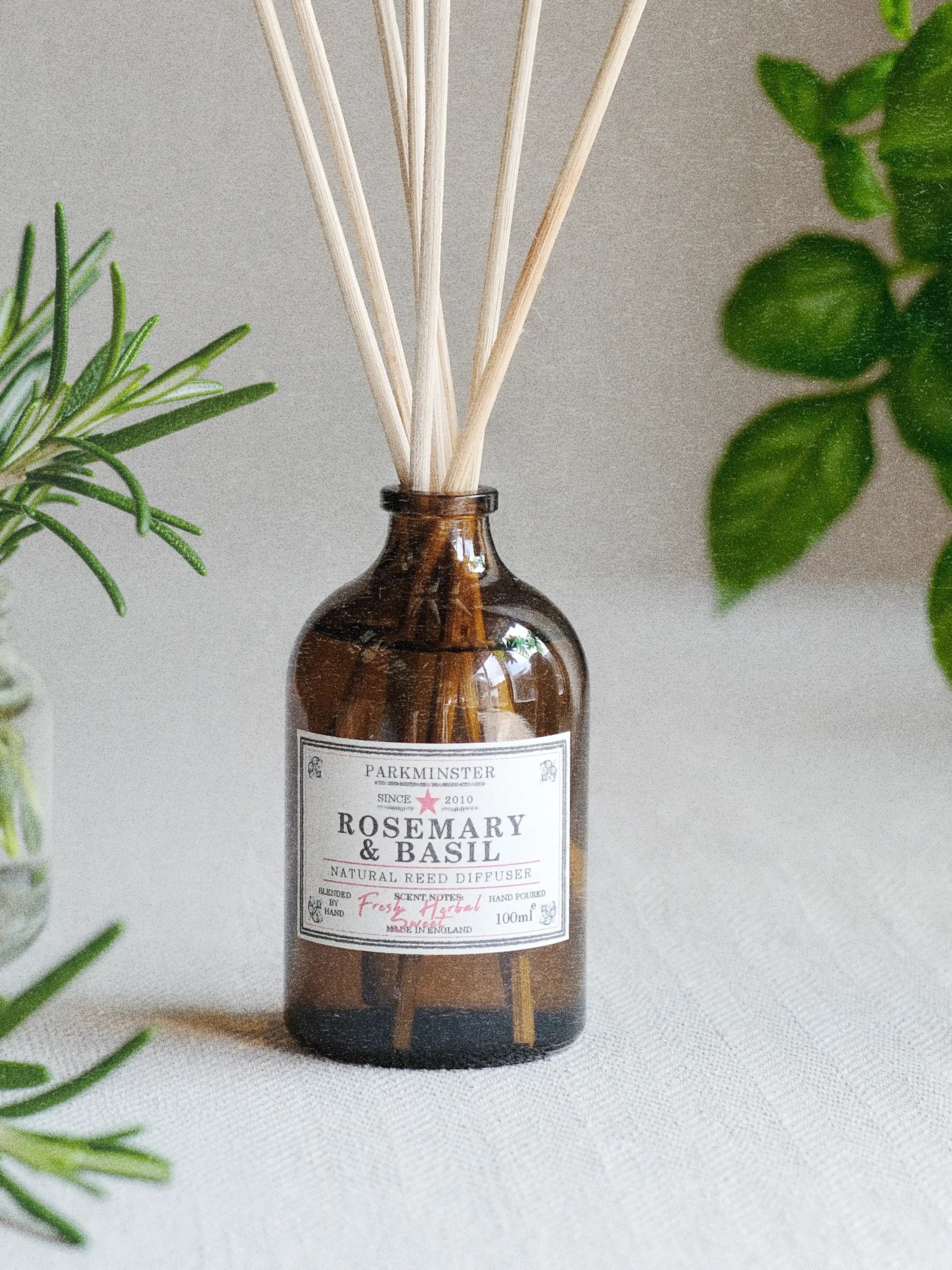 a Parkminster Rosemary and Basil Reed Diffuser in a amber glass jar, made with 100% essential oils for natural botanical home fragrance